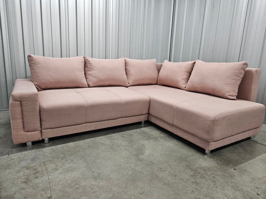 Modern L-shaped sofa in elegant blush pink upholstery